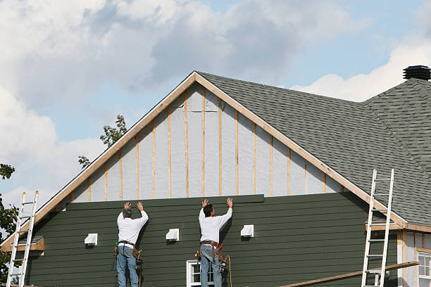 Professional Siding technician working in McLean, TX